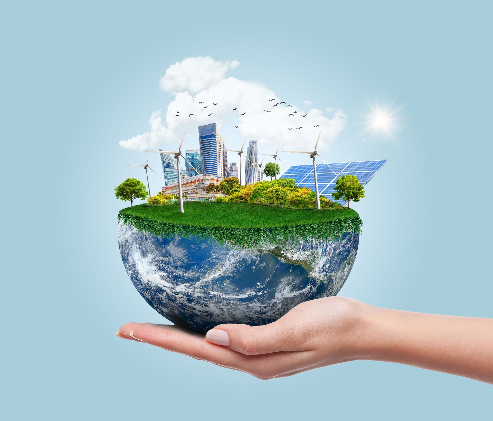Environmental concept with hand holding planet earth showing sustainable and eco-friendly renewable energy